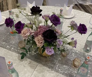 A floral centerpiece with deep red flowers_BlvdChangi