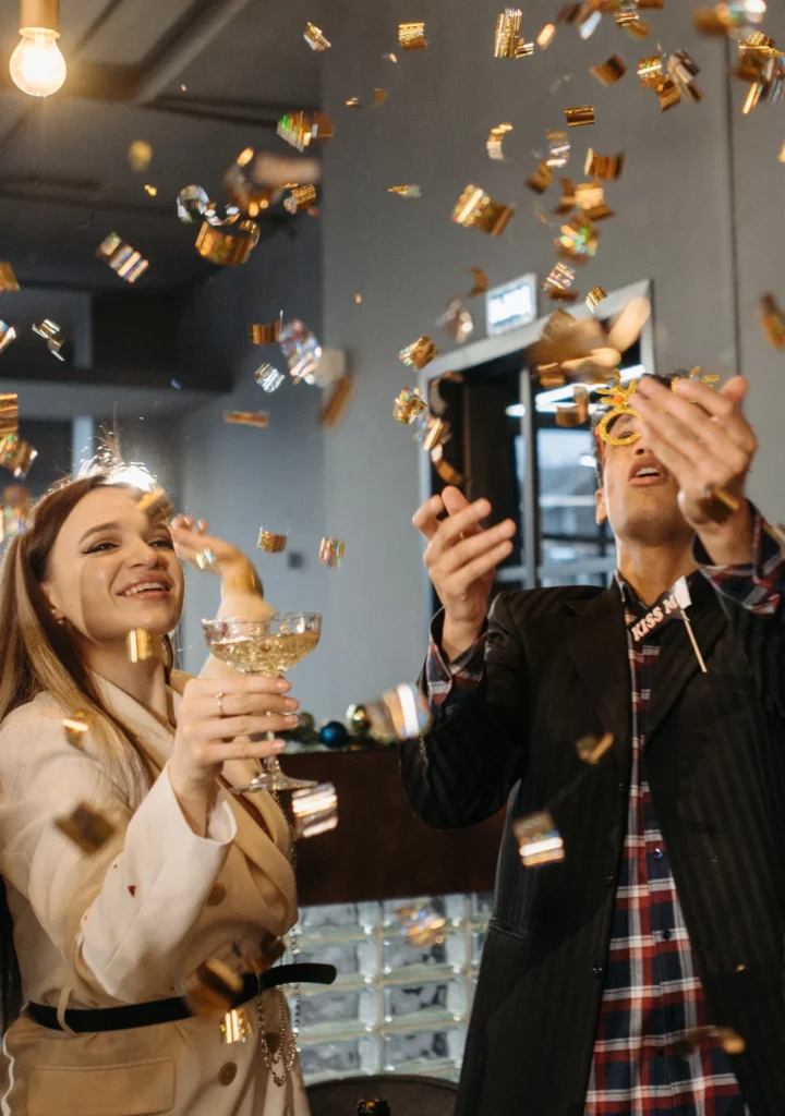 A man and a woman celebrating at an event_BlvdChangi