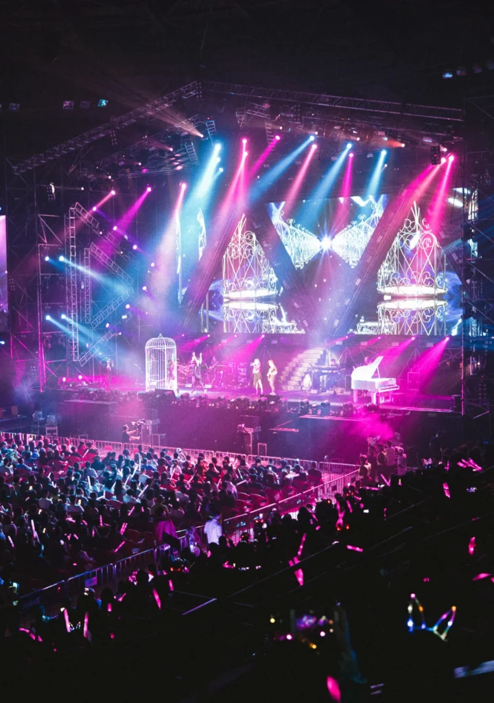A stage with vibrant pink and purple lights_BlvdChangi