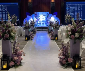 A banquet hall walkway decorated with floral arrangements_BlvdChangi