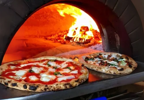 Stone-fired pizza baking in a traditional wood-fired oven at BLVD Changi City Point, Singapore